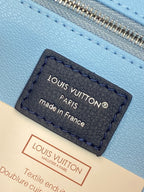 Louis Vuitton Paris label on light blue lining, made in France, textile enduit.