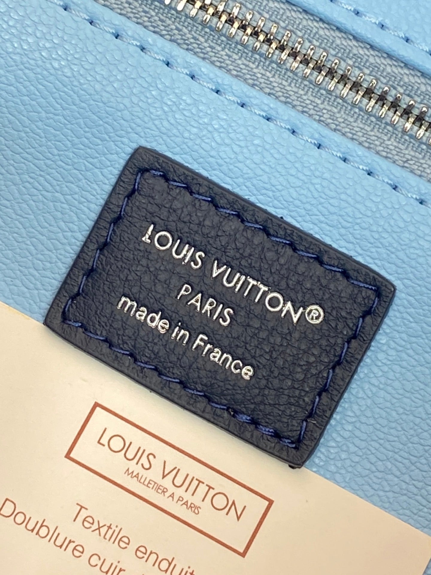 Louis Vuitton Paris label on light blue lining, made in France, textile enduit.