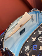 Louis Vuitton bag interior close-up, light blue lining and zip pocket inside.