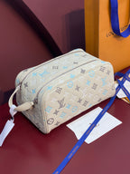 Louis Vuitton monogram crossbody bag in light beige with blue pattern and zip top