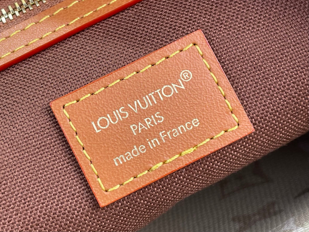 Louis Vuitton canvas bag with leather-trim nameplate, Made in France