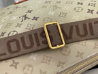 Beige monogram shoulder strap with gold buckle and dark webbing