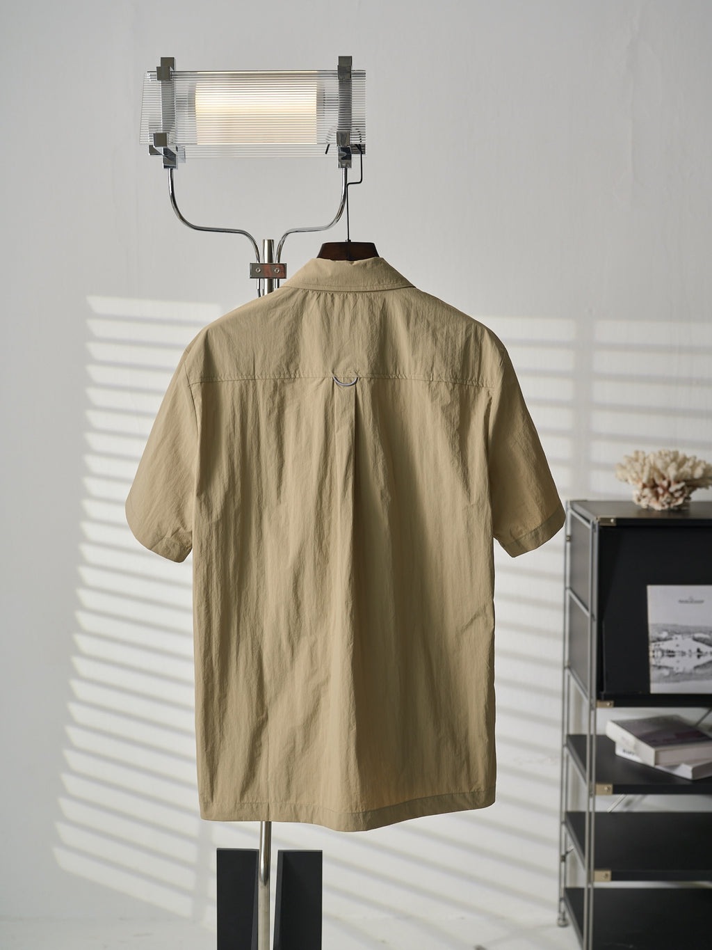 Louis Vuitton light tan short-sleeve shirt with button-up placket and simple back design