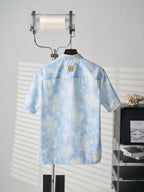 Louis Vuitton light blue short-sleeve button-up shirt back view with label patch