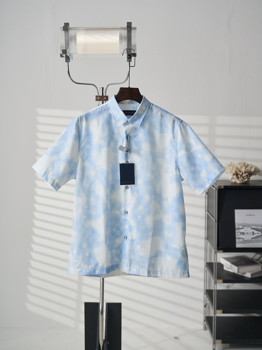 Louis Vuitton light blue short-sleeve button-up shirt on hanger
