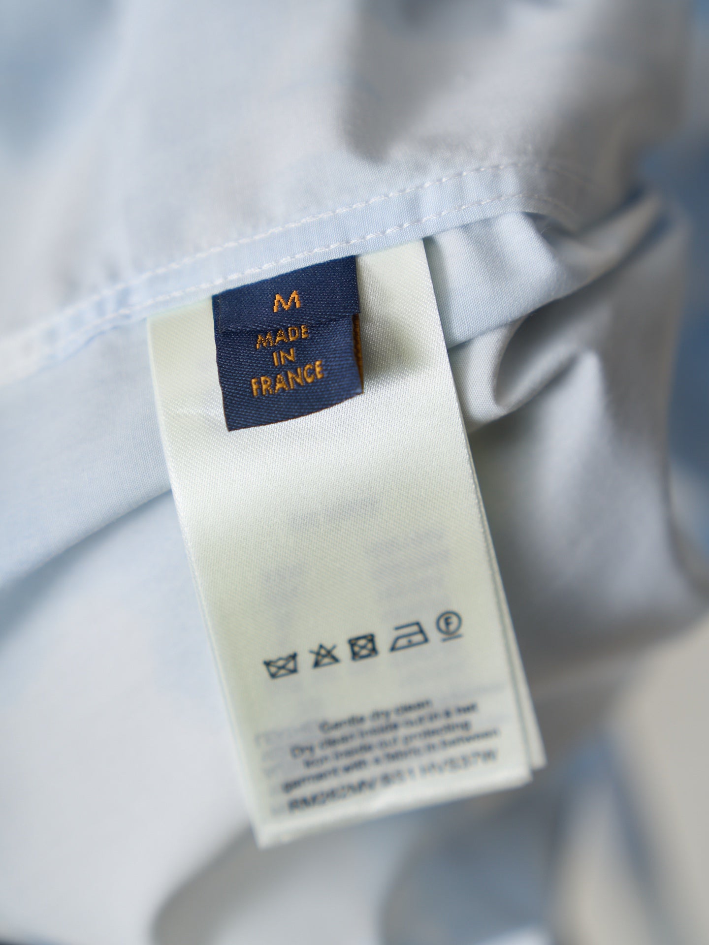 Louis Vuitton light blue shirt inner care label reading "Made in France"