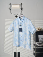 Louis Vuitton light blue short-sleeve button-up shirt on hanger with hang tag