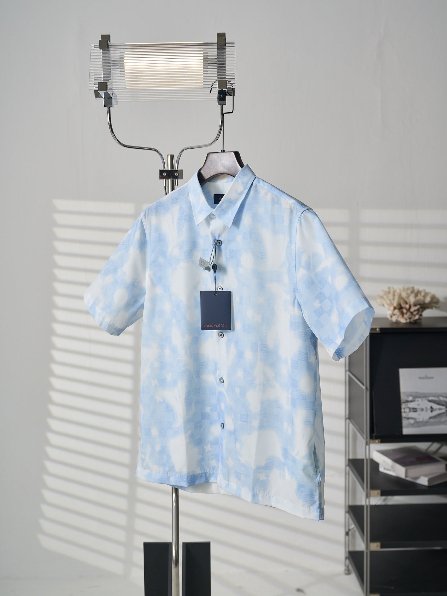 Louis Vuitton light blue short-sleeve button-up shirt on hanger with hang tag