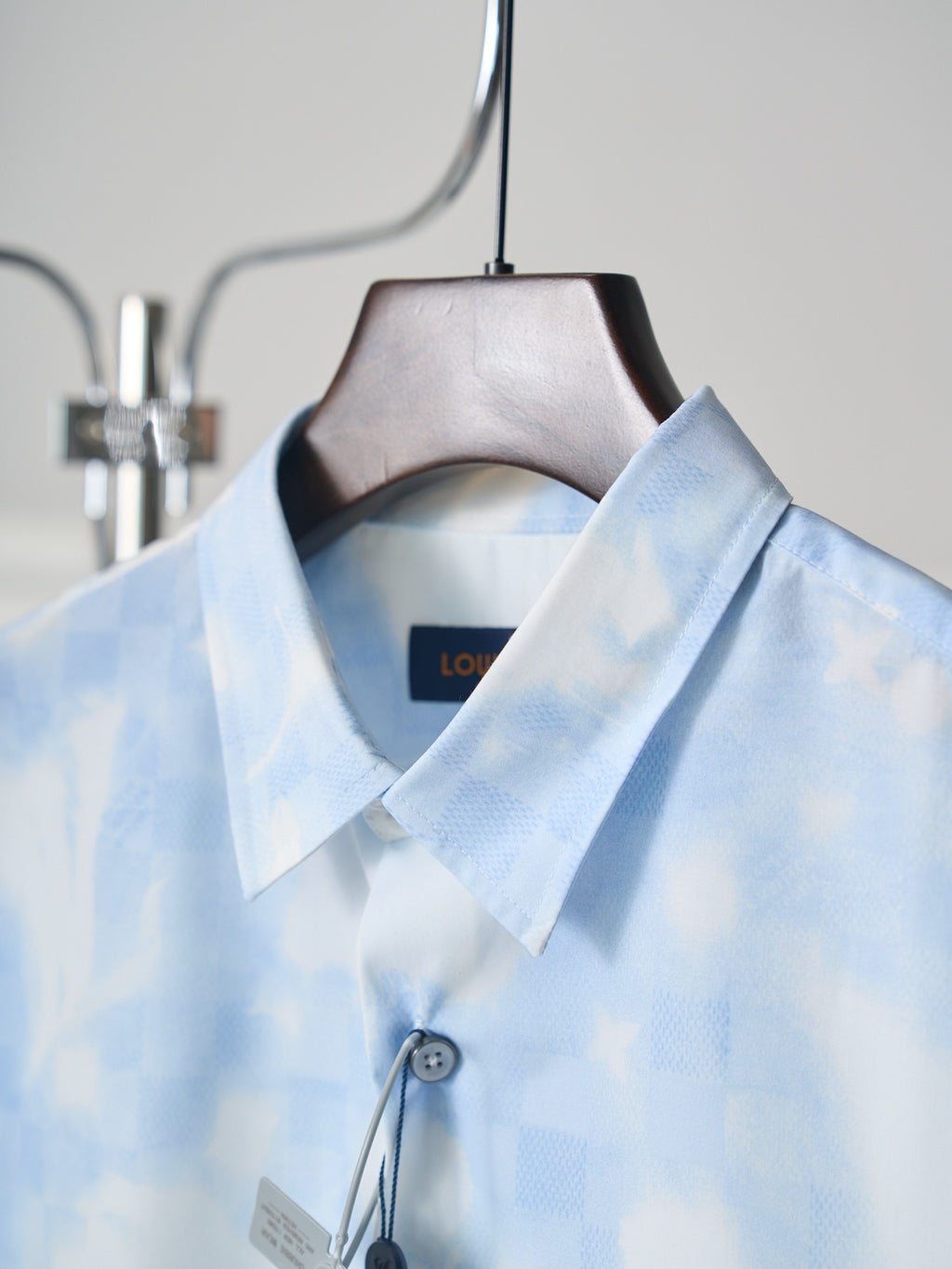 Louis Vuitton light blue short-sleeve shirt close-up of collar and button placket