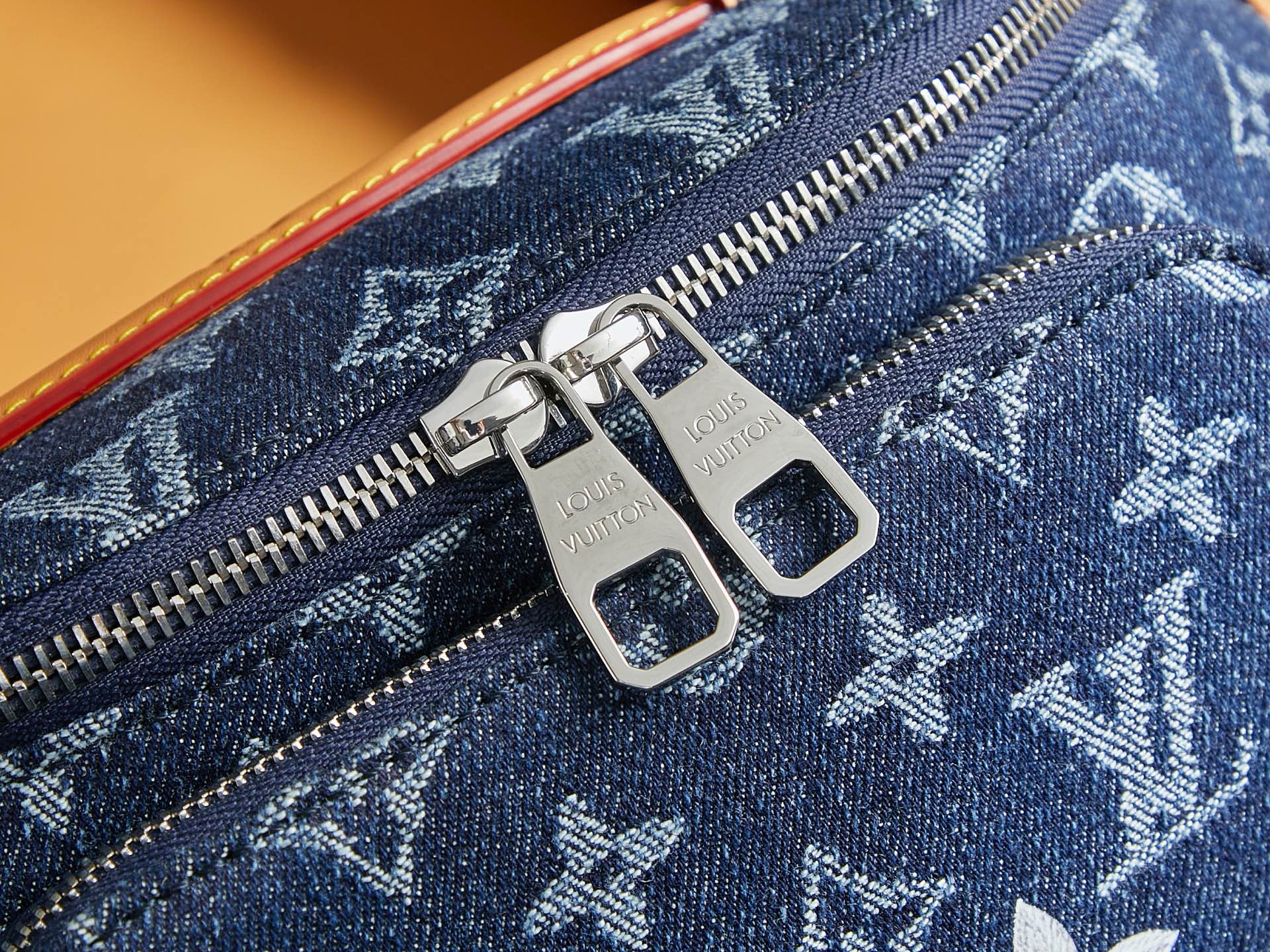 Louis Vuitton monogram denim zipper pull with silver hardware