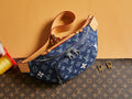 Louis Vuitton denim monogram crossbody bag with tan leather trim and zip pocket