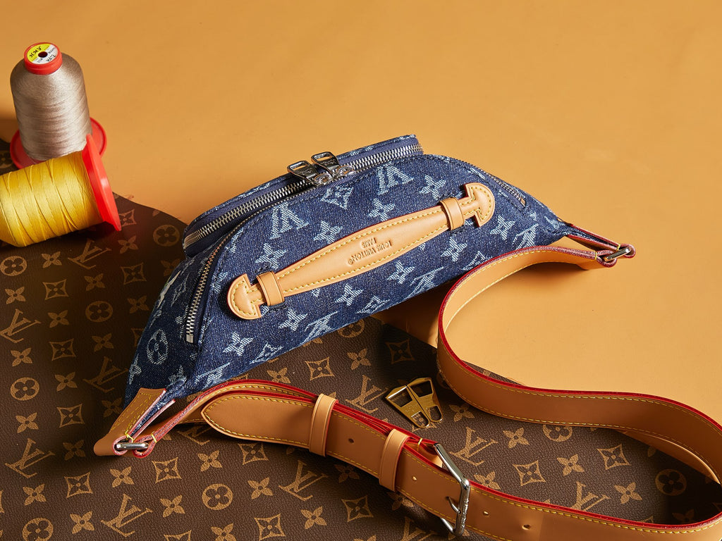 Louis Vuitton denim monogram crossbody bag with tan leather handle and front zip