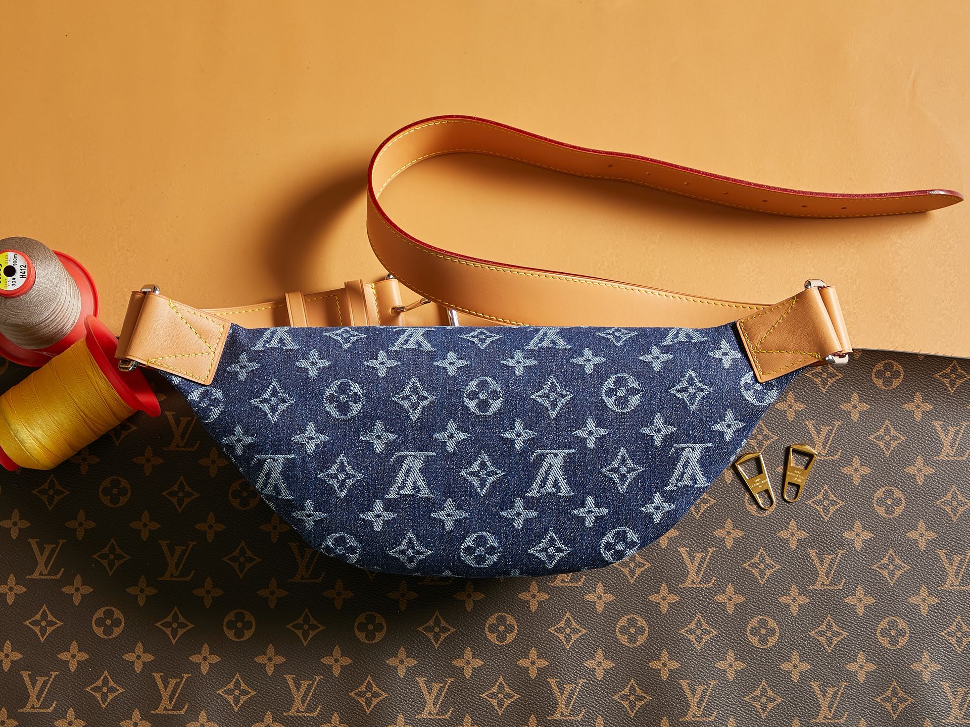 Louis Vuitton denim monogram hobo bag with tan top handle and shoulder strap
