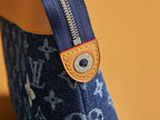 Louis Vuitton pouch zipper pull with tan leather patch and gold-toned rivet