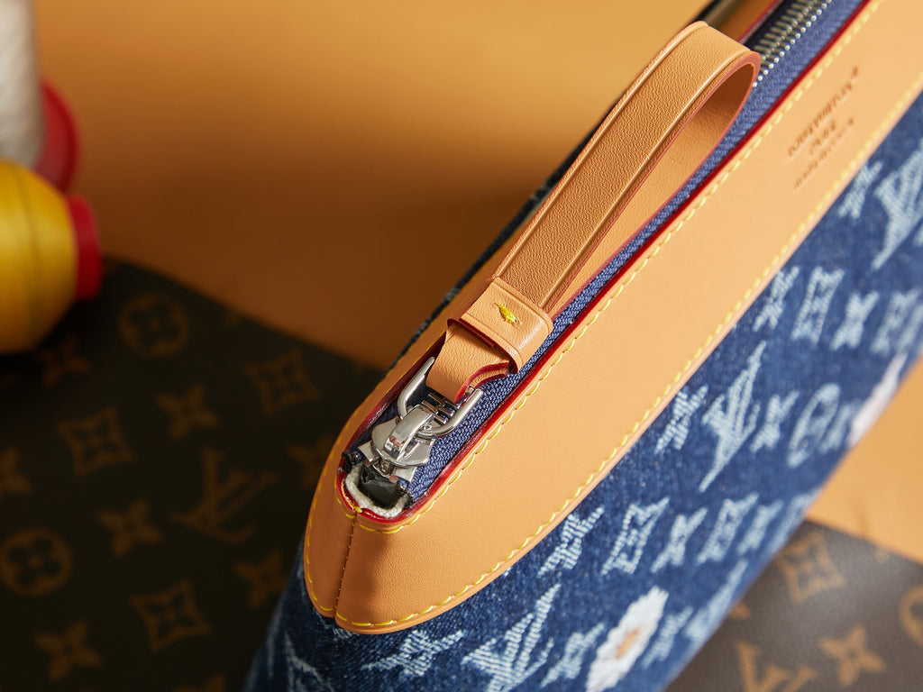 Louis Vuitton pouch top zipper with tan leather edge and gold-toned hardware
