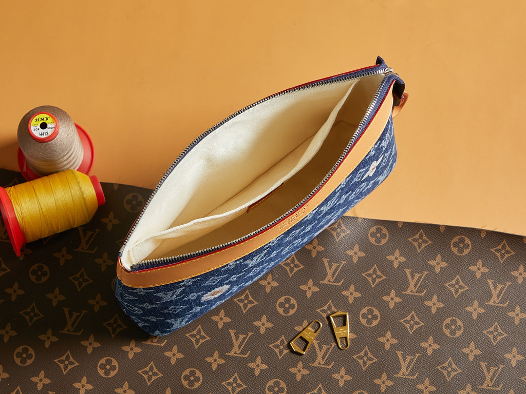 Louis Vuitton monogram pouch with open top, blue fabric, and tan lining