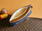 Louis Vuitton monogram pouch with open top, blue fabric, and tan lining