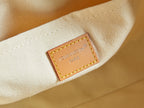 Louis Vuitton Paris leather label on off-white fabric interior