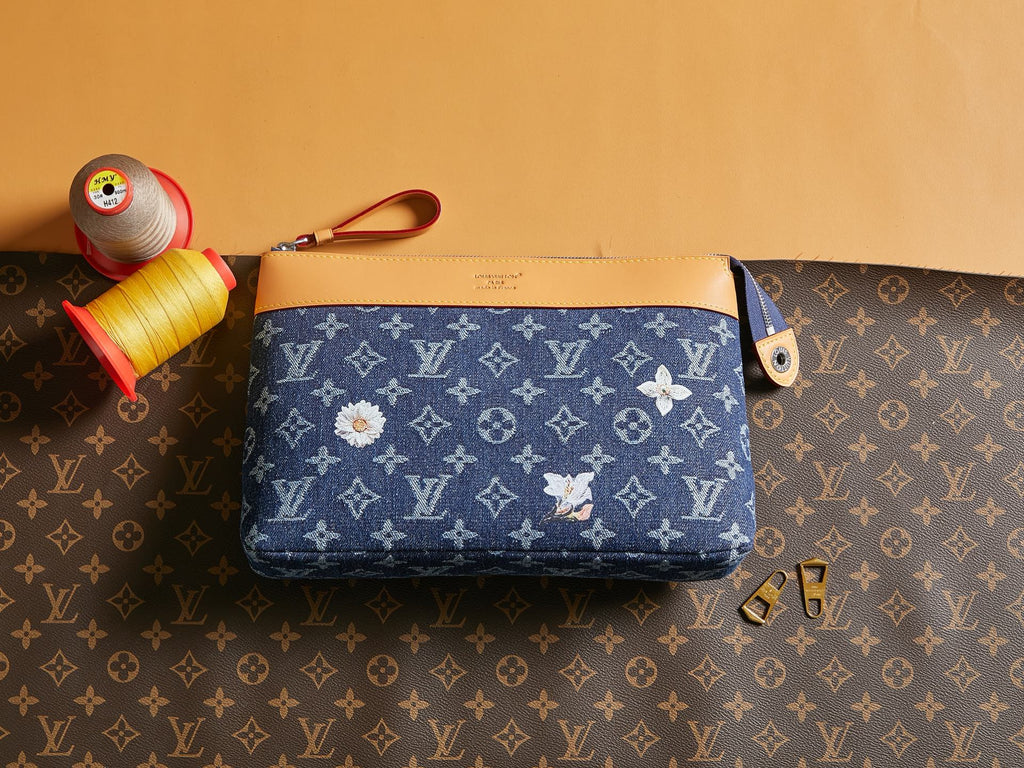 Louis Vuitton monogram pouch with blue canvas and tan leather trim