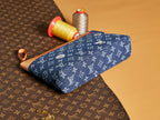 Louis Vuitton monogram pouch in blue with tan edge trim and top zipper
