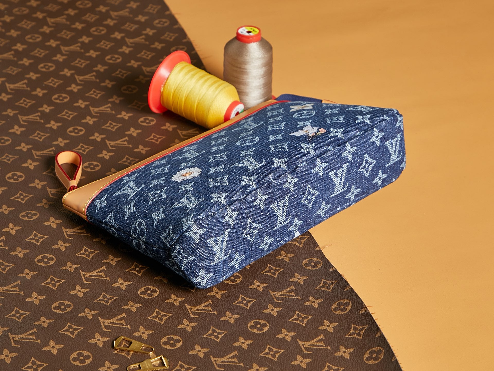 Louis Vuitton monogram pouch in blue with tan edge trim and top zipper