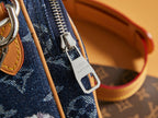 Louis Vuitton logo zipper pull and silver padlock charm on blue bag