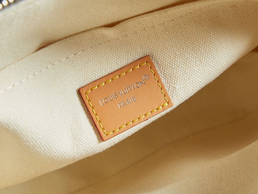 Louis Vuitton Paris stitched label on light interior canvas of bag