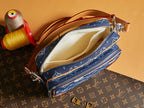 Louis Vuitton blue monogram crossbody bag open, showing tan fabric lining