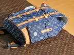 Blue monogram duffel bag with tan trim, top handles, and open interior