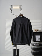 Fendi dark long jacket back view with stand collar and small yellow logo detail
