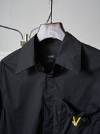 Fendi dark long jacket close-up of stand collar and front button placket