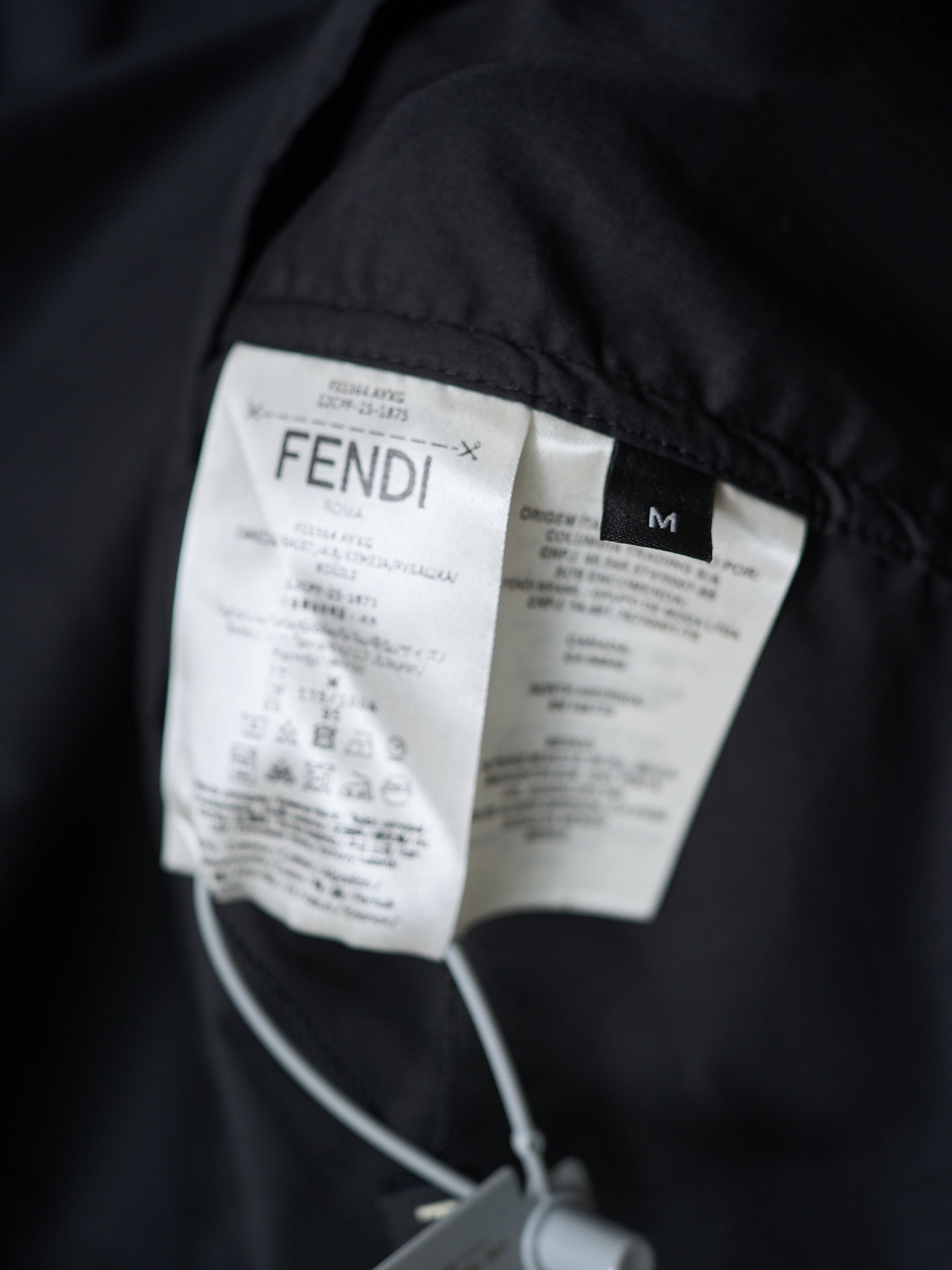 Fendi long jacket inner labels close-up with size M tag