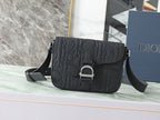 Dior black embossed crossbody bag with flap and adjustable shoulder strap