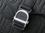 Dior bag hardware clasp with Dior logo on black leather texture