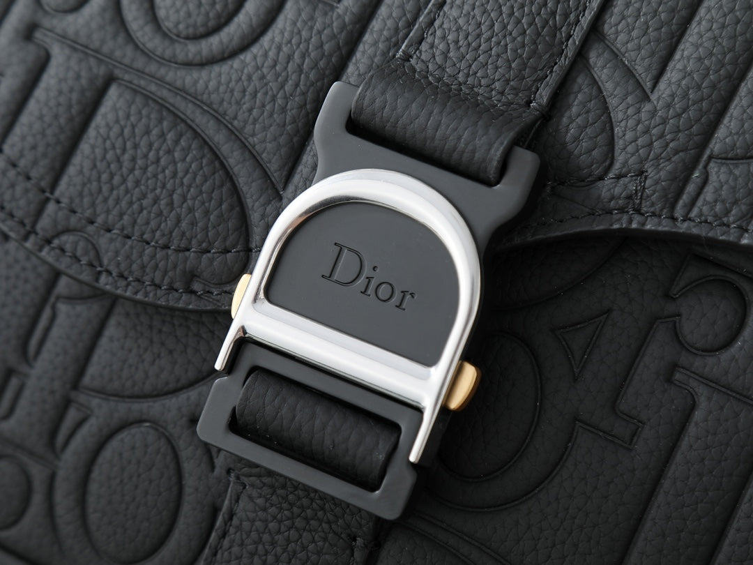 Dior bag hardware clasp with Dior logo on black leather texture