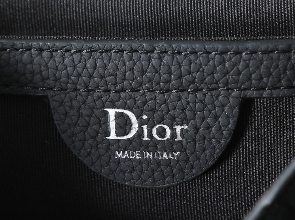 Dior bag interior label reading Dior and Made in Italy