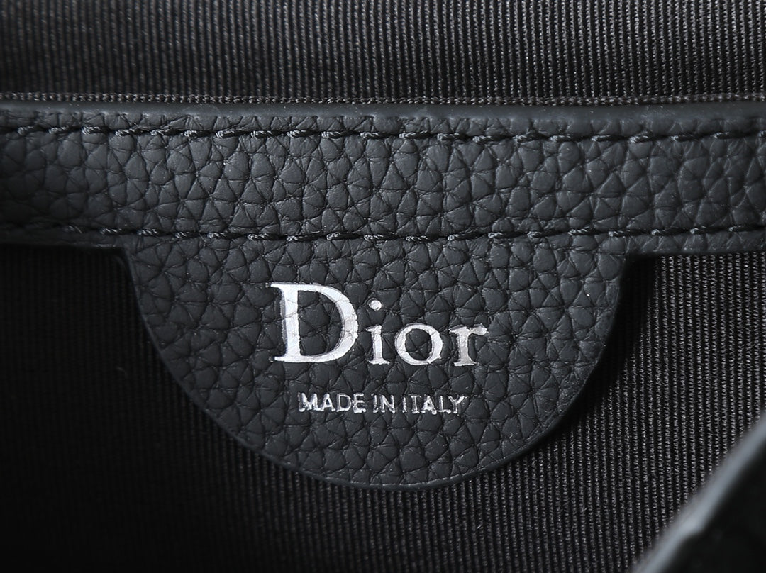 Dior bag interior label reading Dior and Made in Italy
