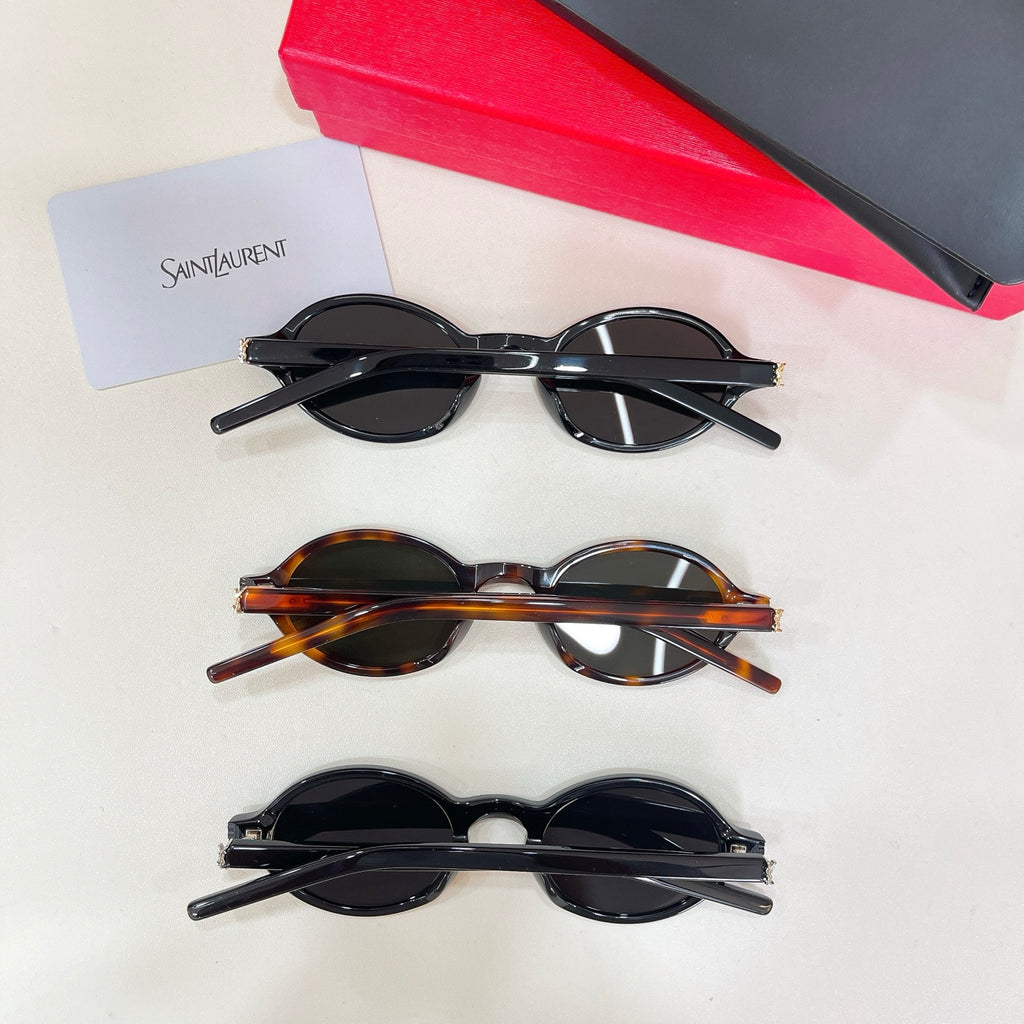 Set of three YSL round sunglasses with dark lenses and mixed frames