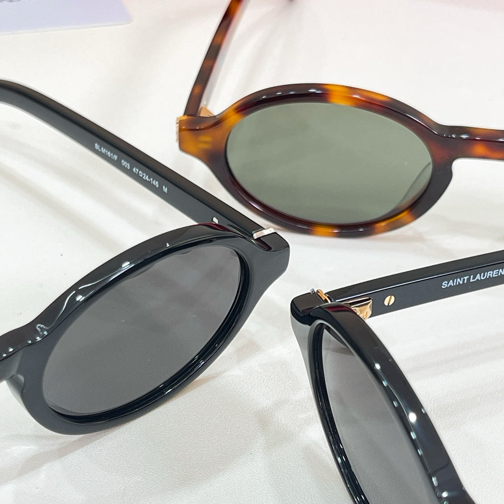 YSL tortoiseshell and black round sunglasses with dark lenses