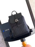 Navy Dior backpack with front flap, metal buckle, and top handle loop