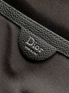 Black leather Dior logo patch on strap near metal ring