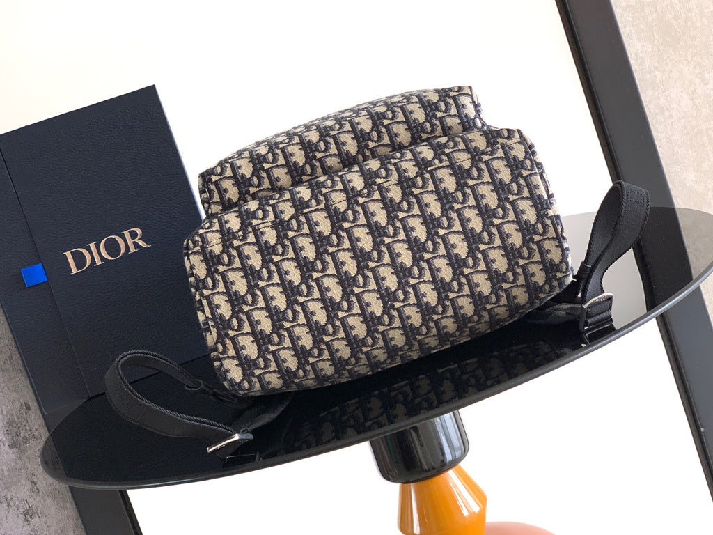 Dior monogram bag with black top handle and adjustable strap