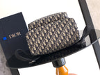 Dior monogram bag with black top handle and adjustable strap