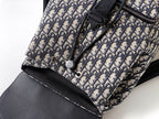 Dior monogram canvas with black zipper pull and small snap closure