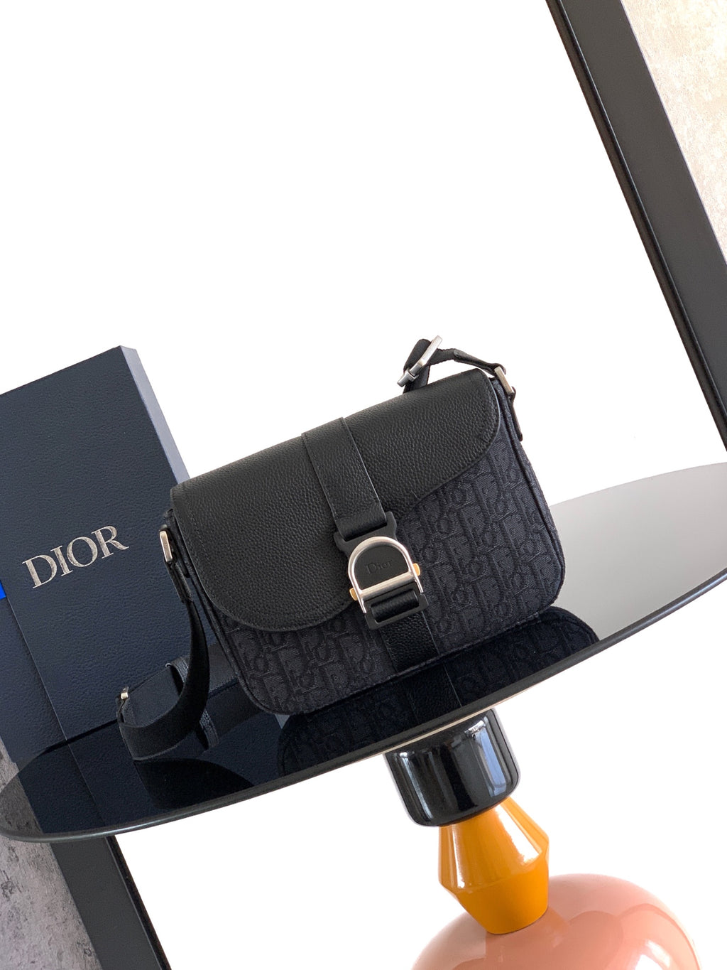 Dior small flap crossbody bag with monogram texture and metal ring clasp