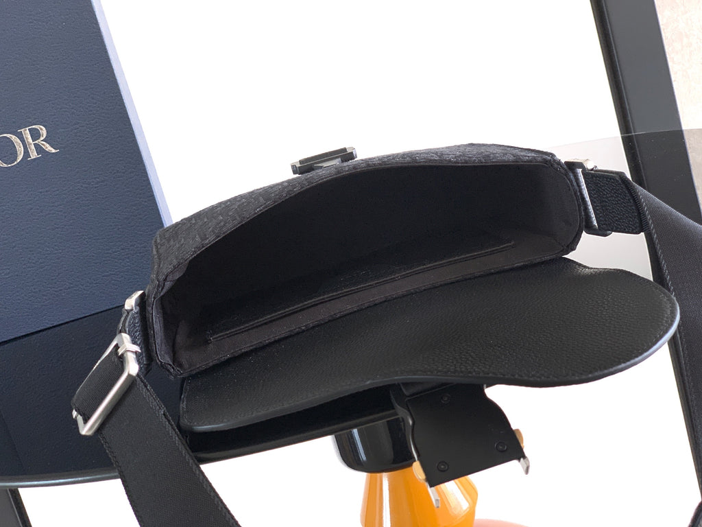 Dior flap crossbody bag open to show inner compartment