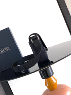 Dior crossbody bag with adjustable strap and flap with metal hardware
