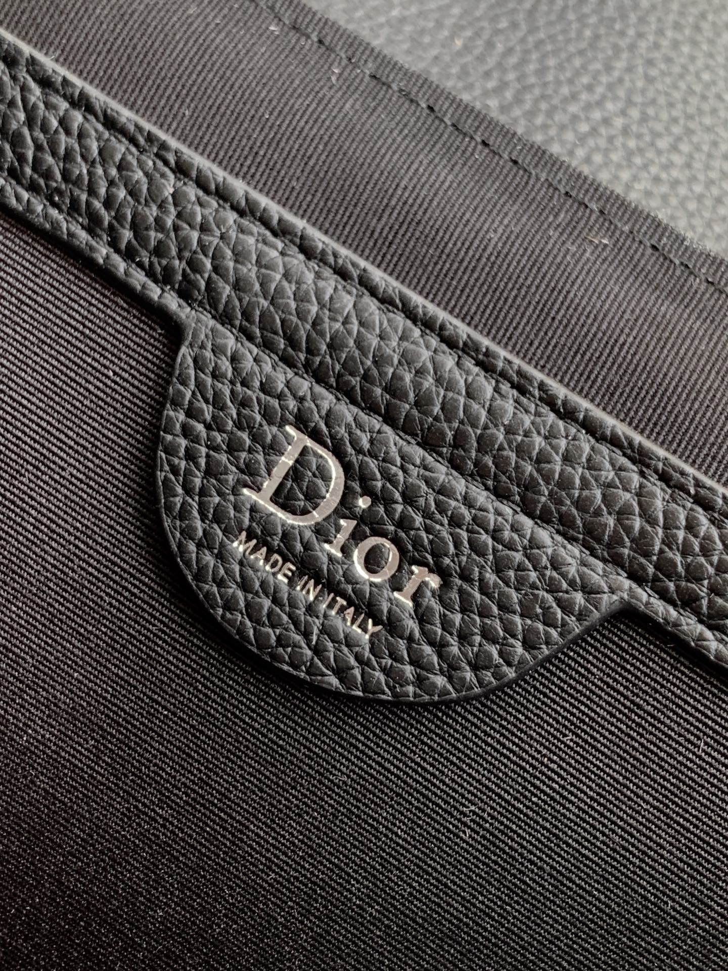 Dior bag logo patch on textured leather interior pocket