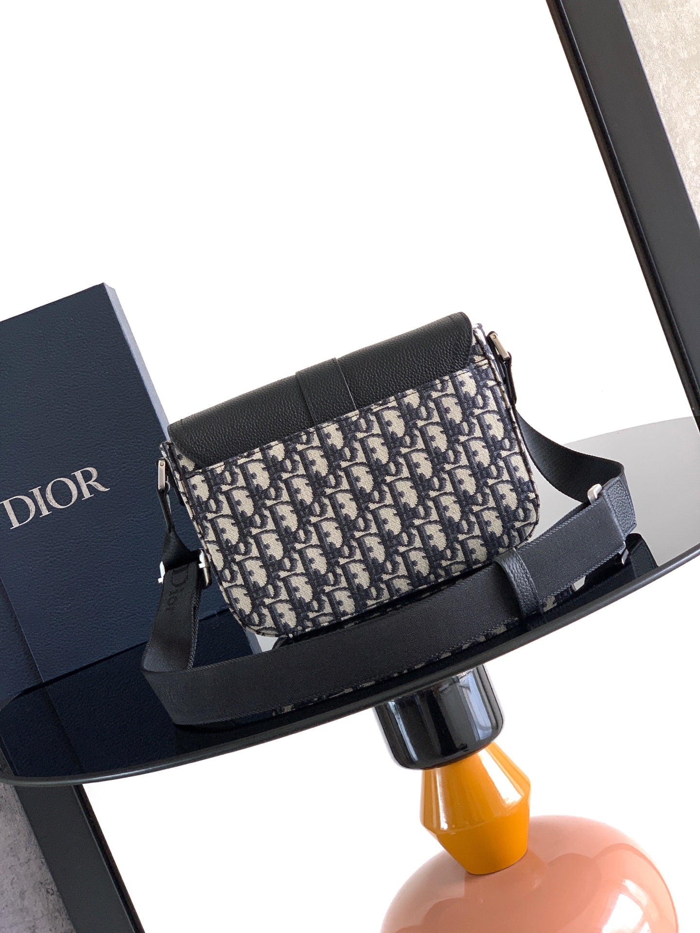 Dior crossbody bag with navy-beige patterned canvas and wide black strap
