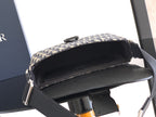 Dior bag open top view with black interior lining and navy-beige canvas